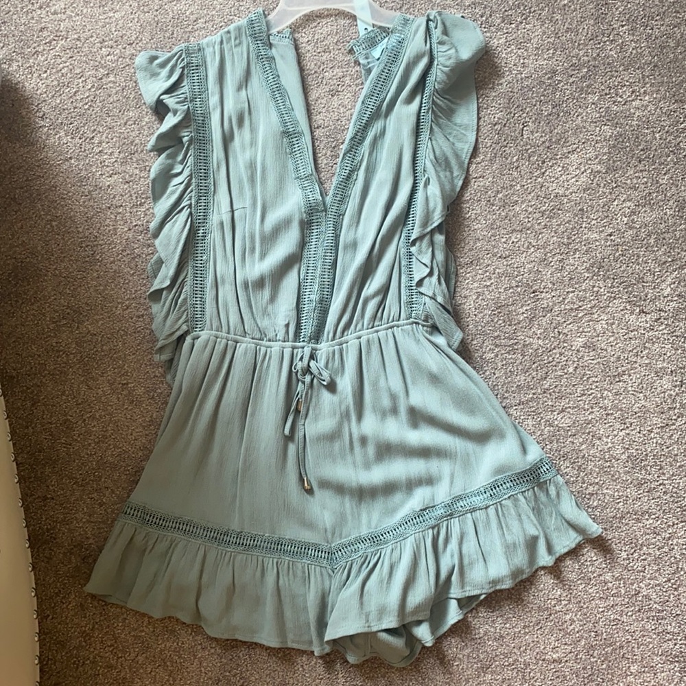 She and sky blue ruffled romper brand new!
